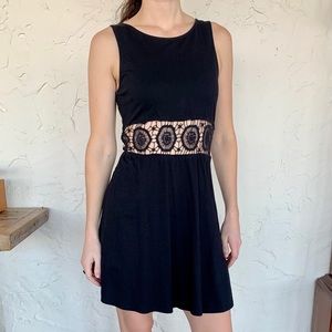 ASOS black mini dress with lace-like cutout detail